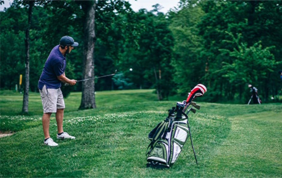 Golfer taking a shot on a golf course